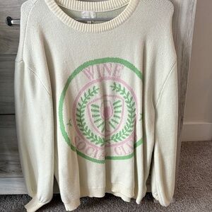 Women's Cream Sweater with Green and Pink Emblem. Wine social club